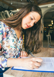 lady signing paper